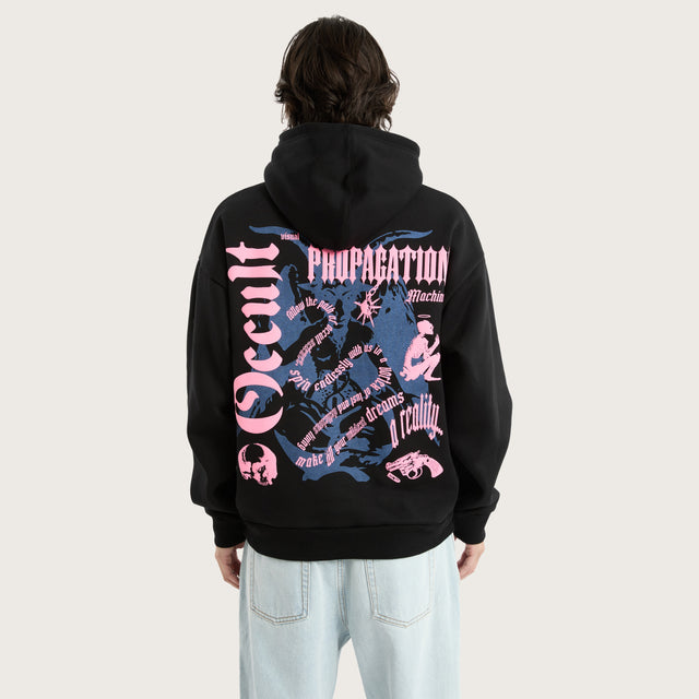 Model wears Occult Oversized Hoodie Jet Black Hoodies in Black - Image 1