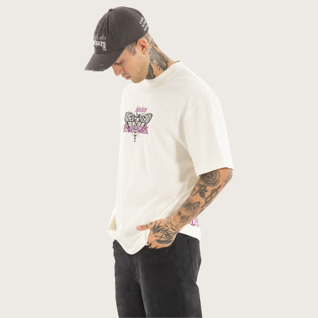 Model wears Desire Street Tee in White T-Shirts in White - Image 3