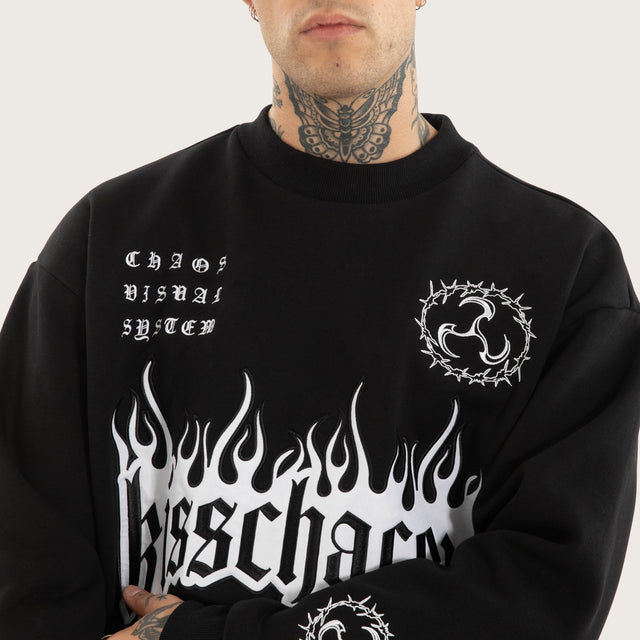 Model wears System Relaxed Sweater Jet Black Jumpers in Black - Image 5