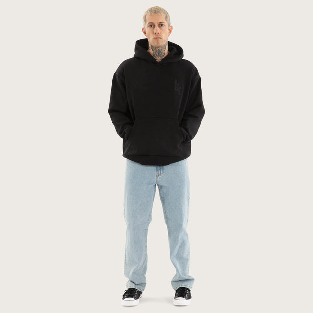 Model wears Chained Relaxed Hoodie Jet Black Hoodies in Black - Image 6