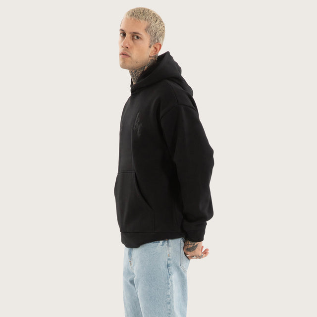Model wears Chained Relaxed Hoodie Jet Black Hoodies in Black - Image 5