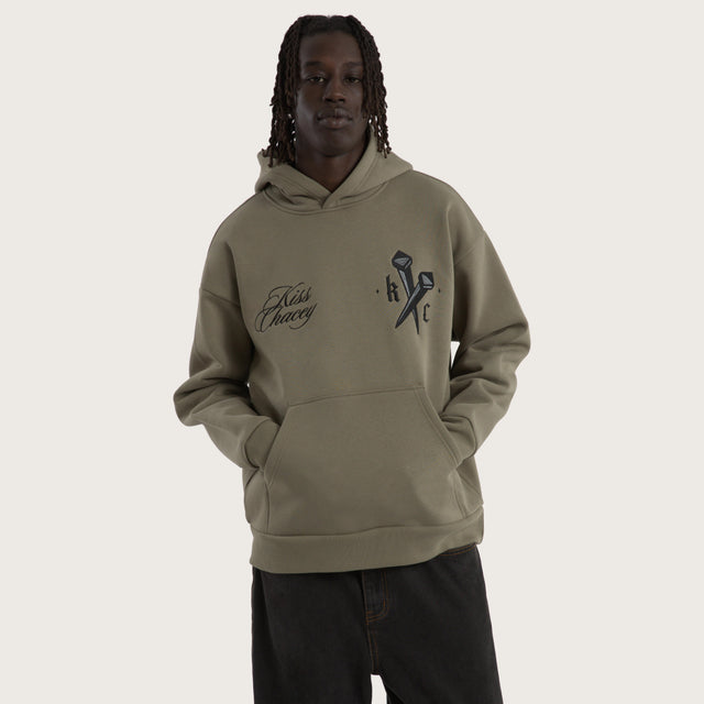 Model wears Nailed Relaxed Hoodie Khaki Hoodies in Green - Image 2