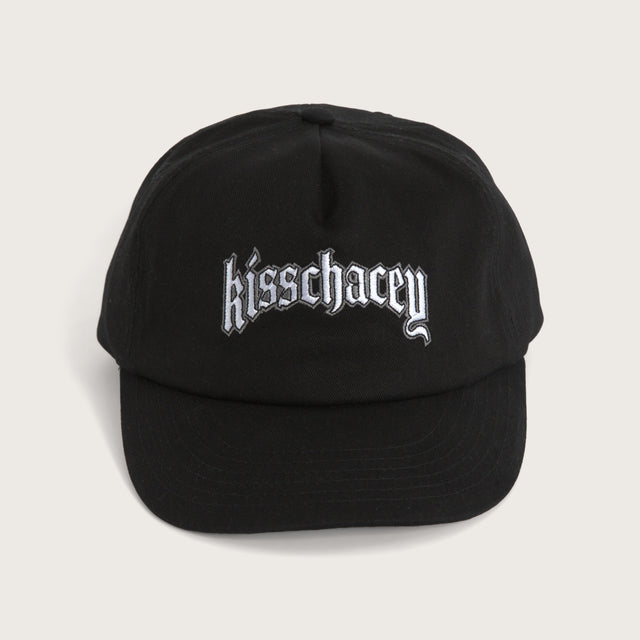 Model wears Archer Cap Jet Black Headwear in Black - Image 1
