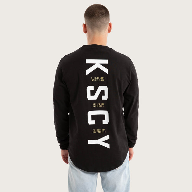 Model wears Lancer Dual Curved Longsleeve Tee Jet Black Longsleeve T-Shirts in Black - Image 1
