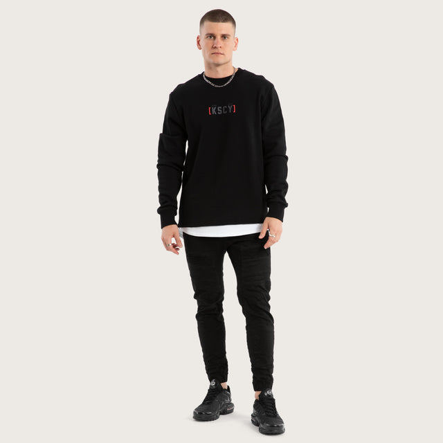 Model wears Unleashed Layered Sweater Jet Black Jumpers in Black - Image 2