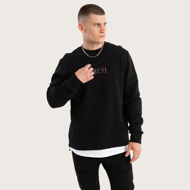 Model wears Unleashed Layered Sweater Jet Black Jumpers in Black - Image 3