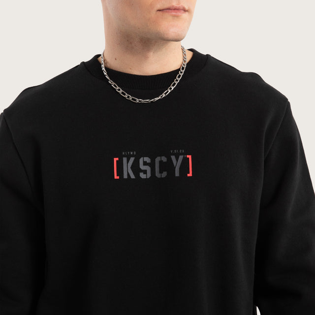 Model wears Unleashed Layered Sweater Jet Black Jumpers in Black - Image 4