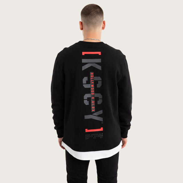 Model wears Unleashed Layered Sweater Jet Black Jumpers in Black - Image 1