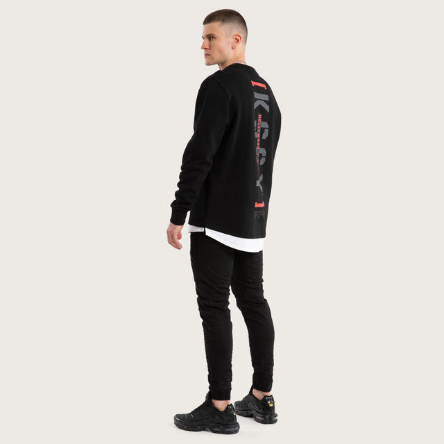 Model wears Unleashed Layered Sweater Jet Black Jumpers in Black - Image 5