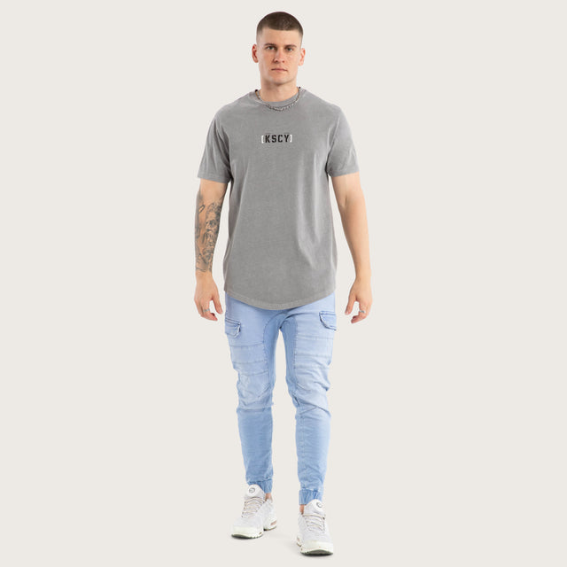 Model wears Unleashed Dual Curved Tee Pigment Frost Grey T-Shirts in Grey - Image 2