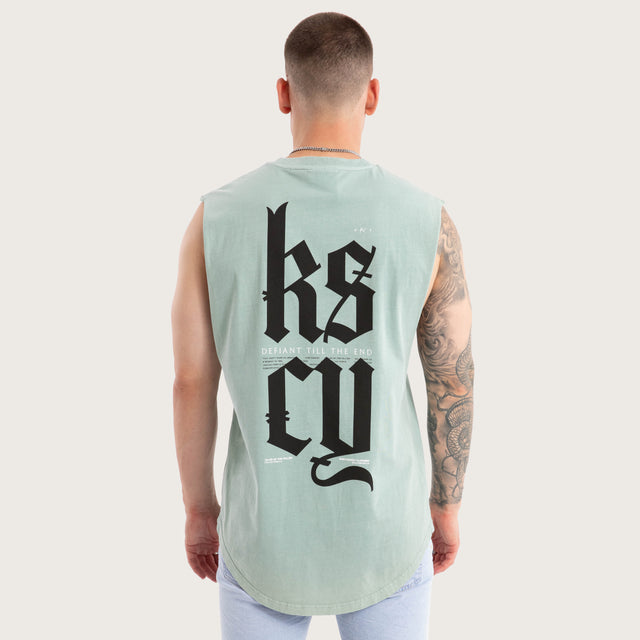 Model wears Thrillify Dual Curved Muscle Pigment Blue Surf Muscle Tees in Blue - Image 1