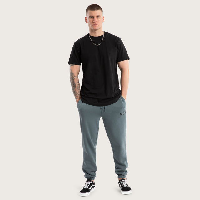 Model wears Brea Trackpant Pigment Stormy Weather Trackpants in Teal - Image 2