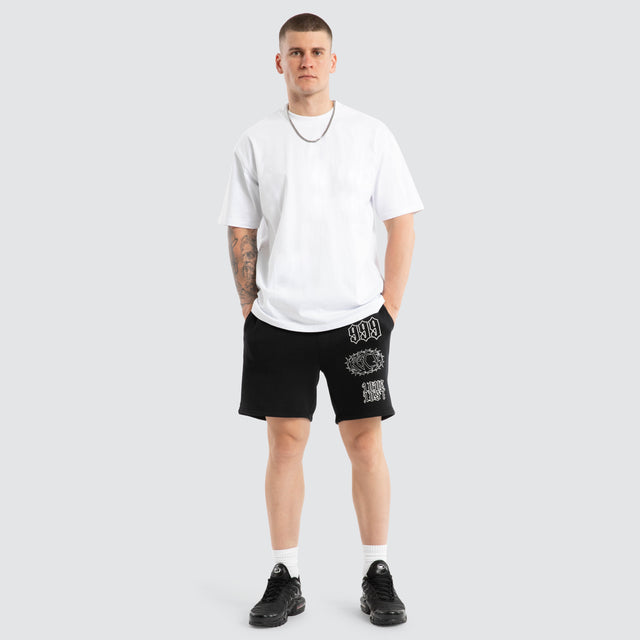 Model wears Unthought Track Short Anthracite Black Shorts in Black - Image 2