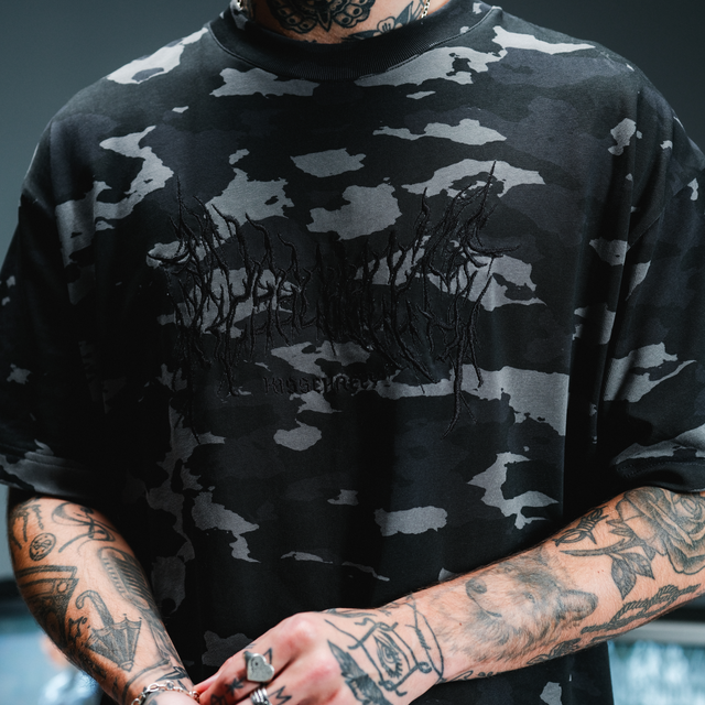 Model wears Camo Street Tee Camo Black T-Shirts in Camo - Image 2