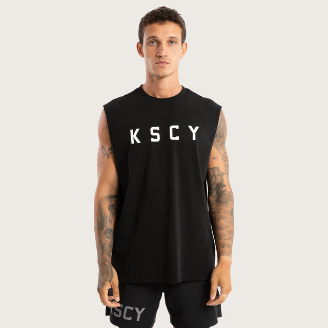 Model wears Vigor Split Hem Muscle Jet Black Muscle Tees in Black - Image 1