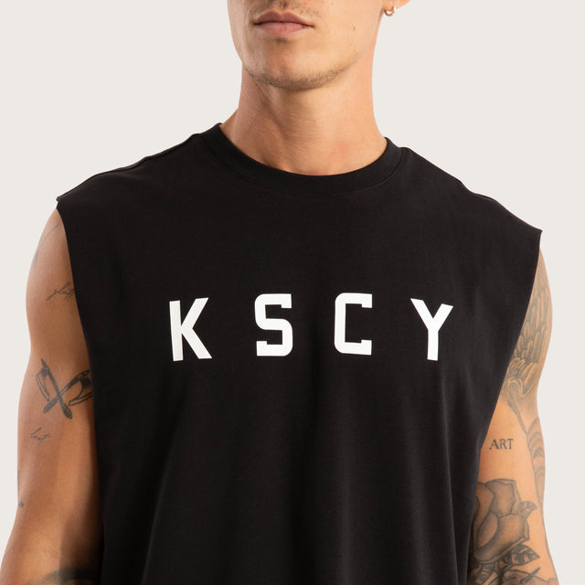 Model wears Vigor Split Hem Muscle Jet Black Muscle Tees in Black - Image 6