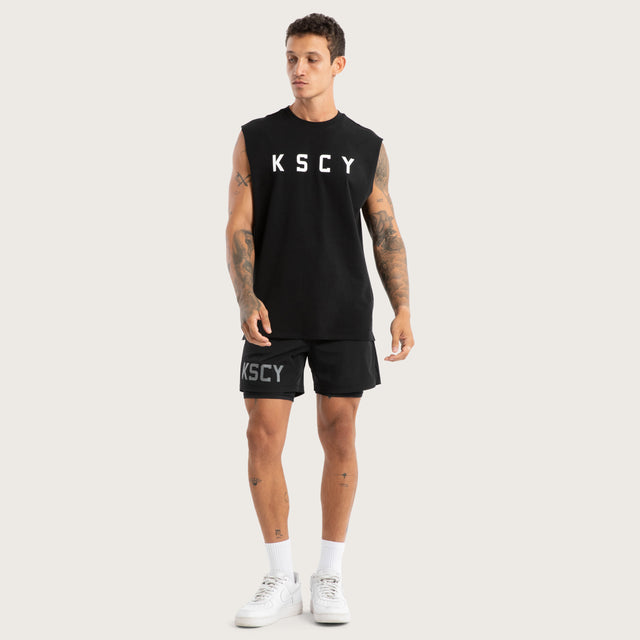Model wears Vigor Split Hem Muscle Jet Black Muscle Tees in Black - Image 5