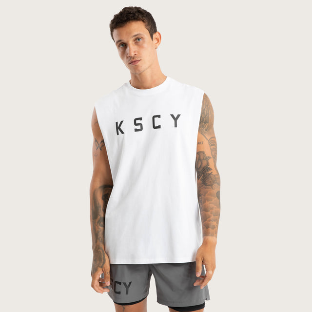 Model wears Vigor Split Hem Muscle Optical White Muscle Tees in White - Image 1