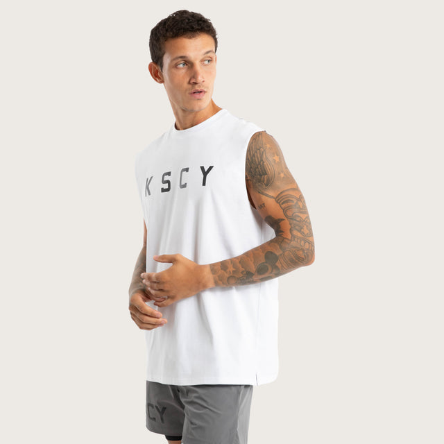 Model wears Vigor Split Hem Muscle Optical White Muscle Tees in White - Image 3