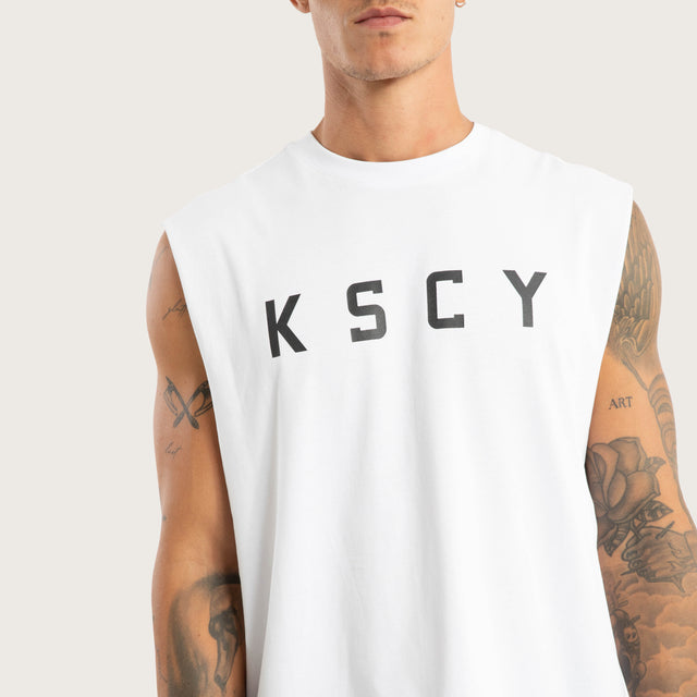 Model wears Vigor Split Hem Muscle Optical White Muscle Tees in White - Image 6