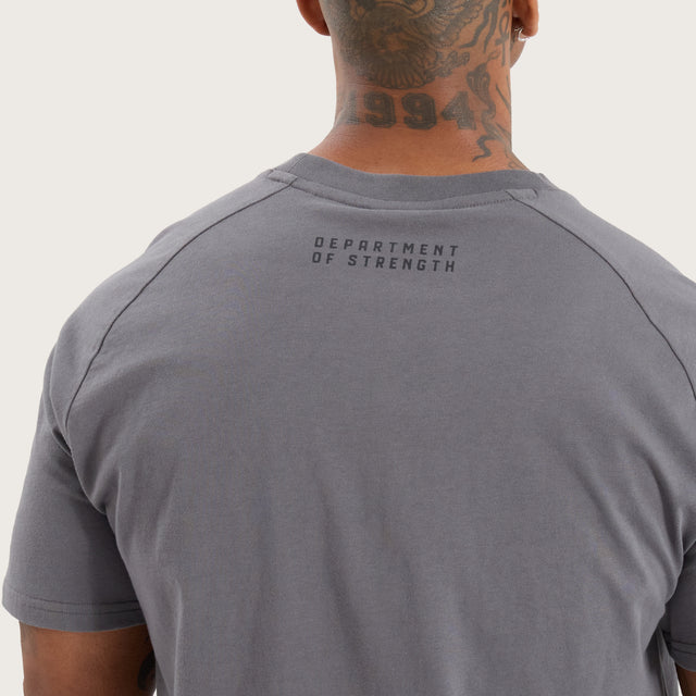 Model wears Vital Raglan Dual Curved Tee Charcoal T-Shirts in Grey - Image 5