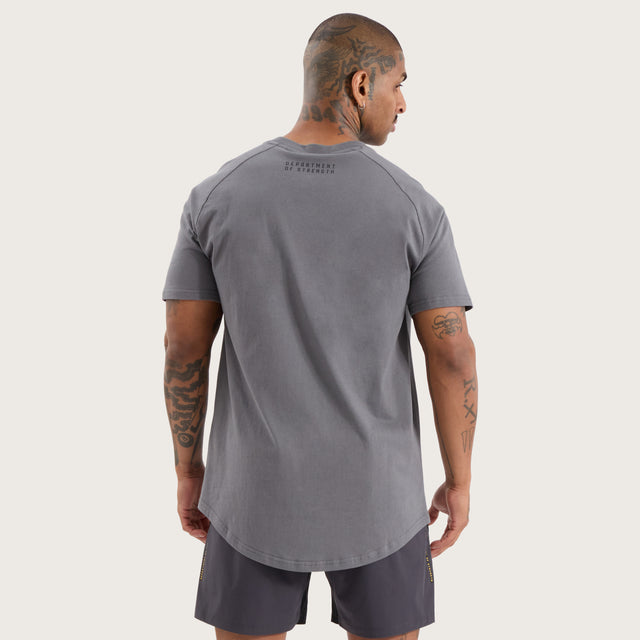 Model wears Vital Raglan Dual Curved Tee Charcoal T-Shirts in Grey - Image 6