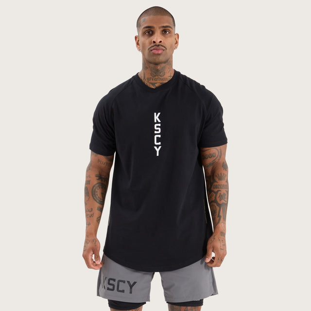 Model wears Venture Raglan Dual Curved Tee Jet Black T-Shirts in Black - Image 2