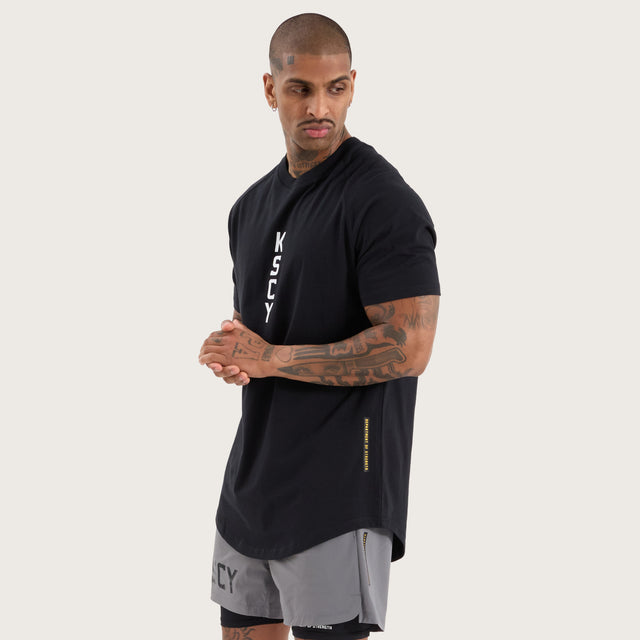 Model wears Venture Raglan Dual Curved Tee Jet Black T-Shirts in Black - Image 3