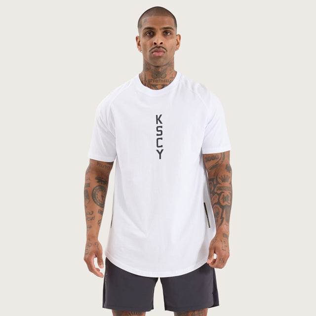 Model wears Venture Raglan Dual Curved Tee Optical White T-Shirts in White - Image 5
