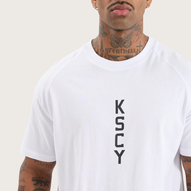 Model wears Venture Raglan Dual Curved Tee Optical White T-Shirts in White - Image 3