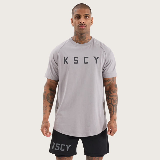 Model wears Rapid Raglan Dual Curved Tee Alloy T-Shirts in Grey - Image 5