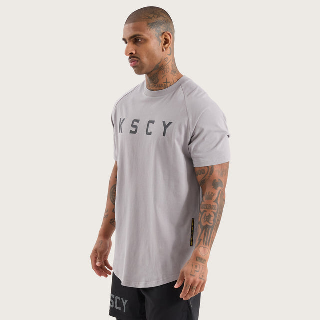 Model wears Rapid Raglan Dual Curved Tee Alloy T-Shirts in Grey - Image 6