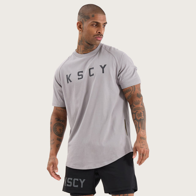 Model wears Rapid Raglan Dual Curved Tee Alloy T-Shirts in Grey - Image 1