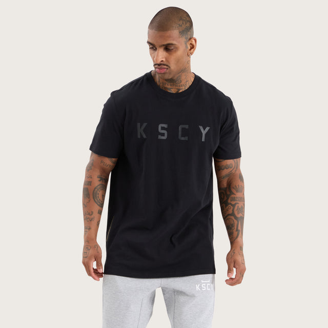 Model wears Glide Active Tee Jet Black T-Shirts in Black - Image 4