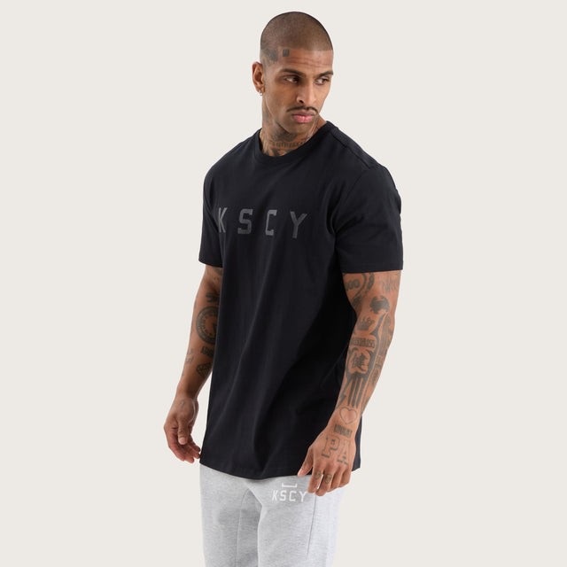 Model wears Glide Active Tee Jet Black T-Shirts in Black - Image 1