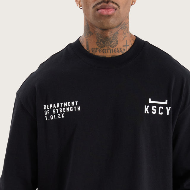 Model wears Strive Longsleeve Split Hem Tee Jet Black Longsleeve T-Shirts in Black - Image 3
