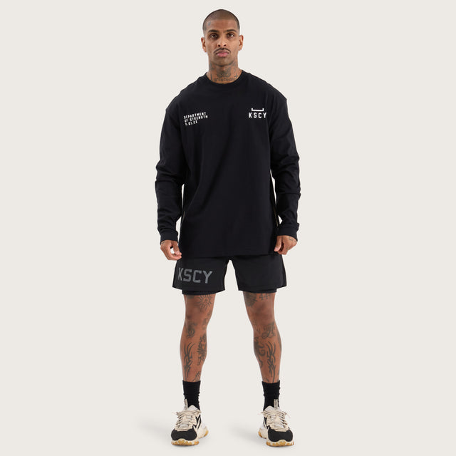 Model wears Strive Longsleeve Split Hem Tee Jet Black Longsleeve T-Shirts in Black - Image 4