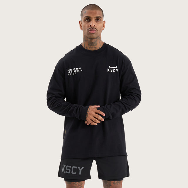 Model wears Strive Longsleeve Split Hem Tee Jet Black Longsleeve T-Shirts in Black - Image 1