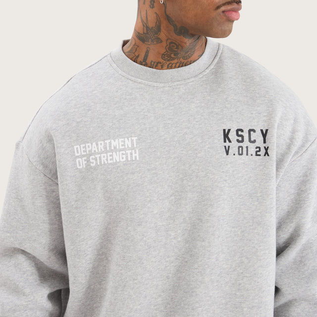 Model wears Epic Relaxed Sweater Grey Marle Jumpers in Grey - Image 3