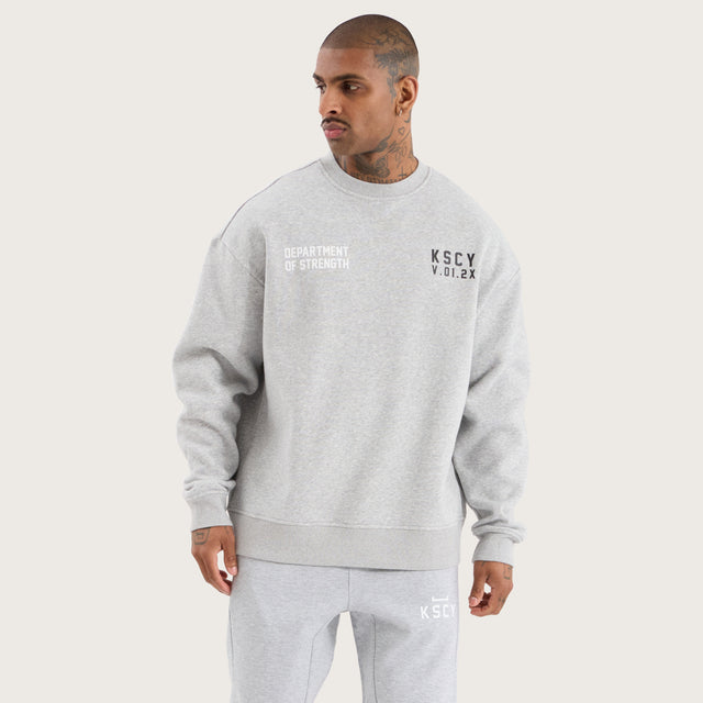 Model wears Epic Relaxed Sweater Grey Marle Jumpers in Grey - Image 2