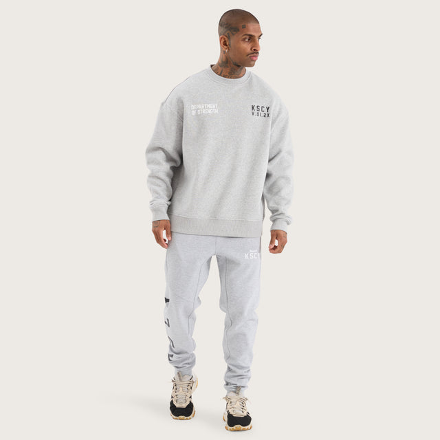 Model wears Epic Relaxed Sweater Grey Marle Jumpers in Grey - Image 6