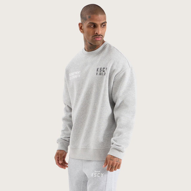 Model wears Epic Relaxed Sweater Grey Marle Jumpers in Grey - Image 5