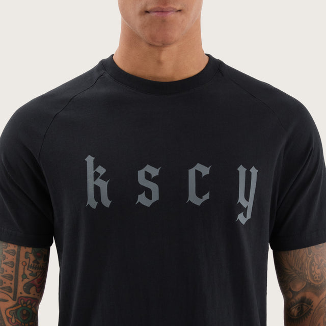 Model wears Apex Raglan Dual Curved Tee DOS Black T-Shirts in Black - Image 3