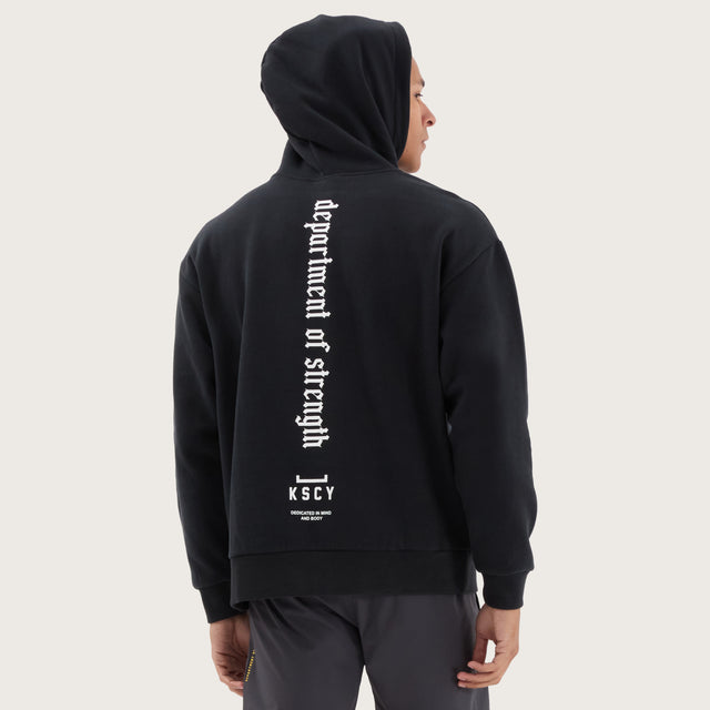 Model wears Stamina Relaxed Hoodie DOS Black Hoodies in Black - Image 2