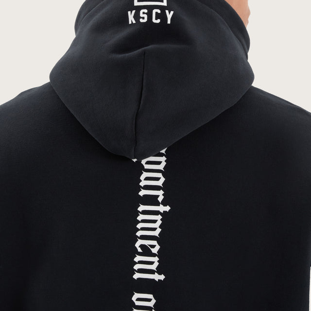 Model wears Stamina Relaxed Hoodie DOS Black Hoodies in Black - Image 4
