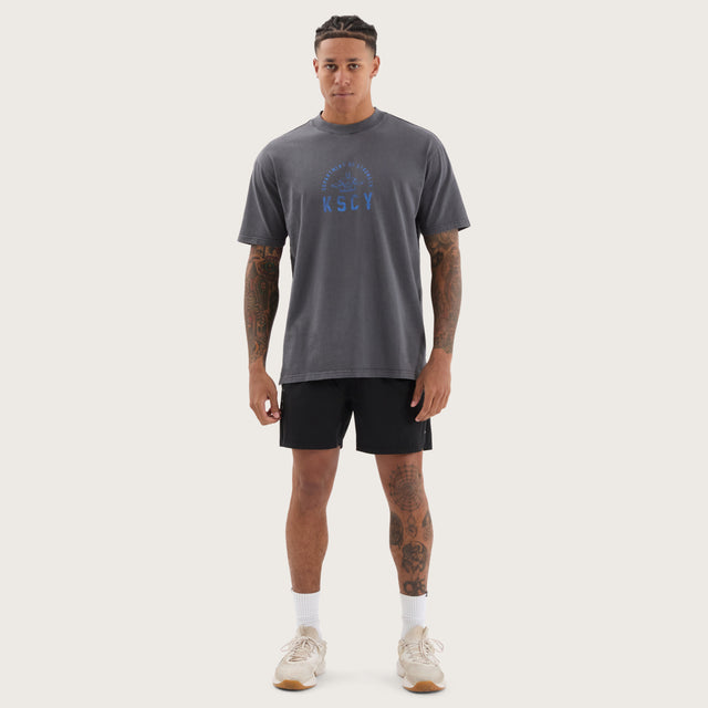 Model wears Stride Box Fit Tee Pigment Asphalt T-Shirts in Grey - Image 4