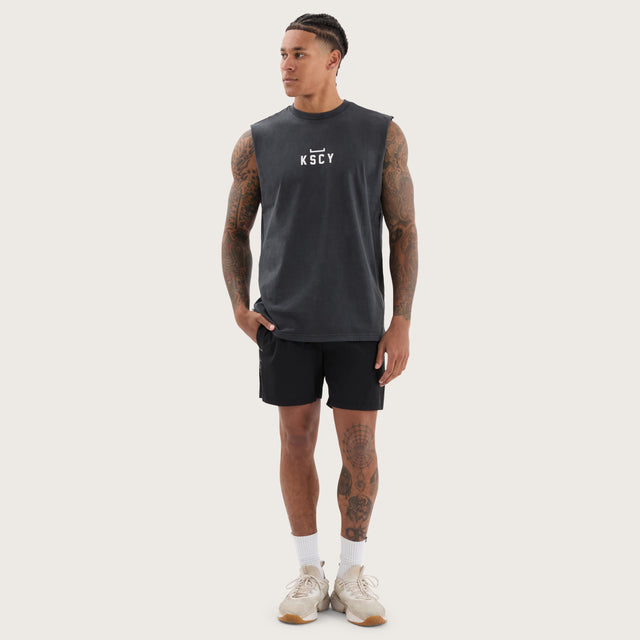 Model wears Salute Split Hem Muscle Pigment Black Muscle Tees in Black - Image 4