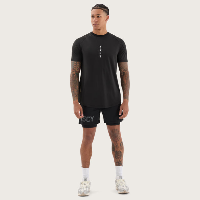 Model wears Fortify Raglan Dual Curved Active Tee Black/Asphalt T-Shirts in Black - Image 4
