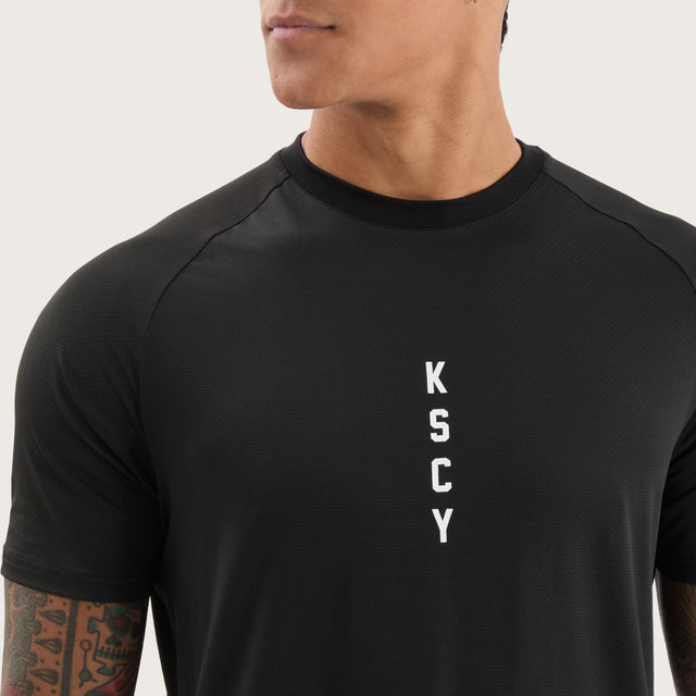 Model wears Fortify Raglan Dual Curved Active Tee Black/Asphalt T-Shirts in Black - Image 3