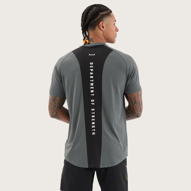 Model wears Fortify Raglan Dual Curved Active Tee Shadow/Jet Black T-Shirts in Grey - Image 1
